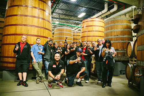 GABF-day-2-28small Team Stone in front of giant barrels